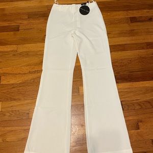 White medium pants. Zip in the back. Belt loops. Never been worn
